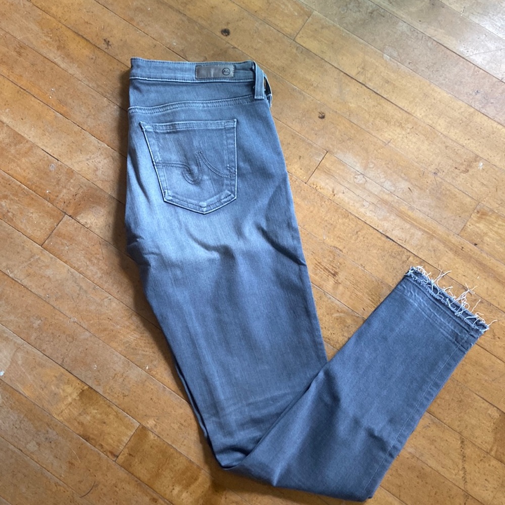 AG gray skinny jeans with raw hem